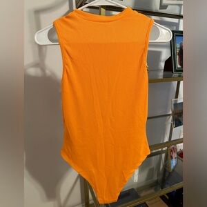Orange short sleeve rubbed bodysuit